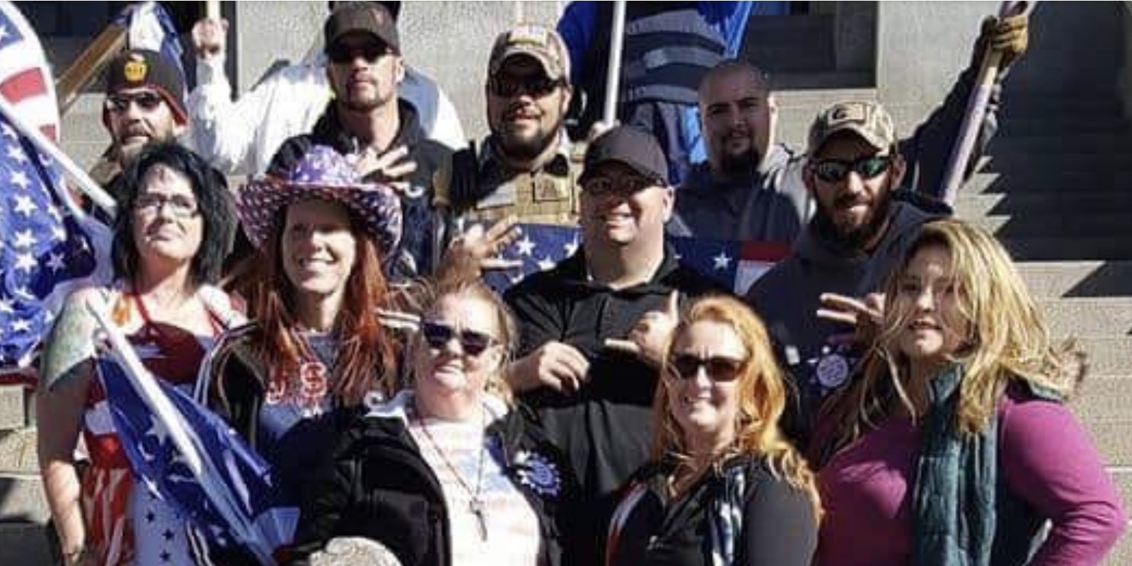 Ty Winter displays 3UP handing on west steps of Colorado Capital