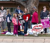 Anti-Abortion protestors rally in front of RISE Collective, Boulder