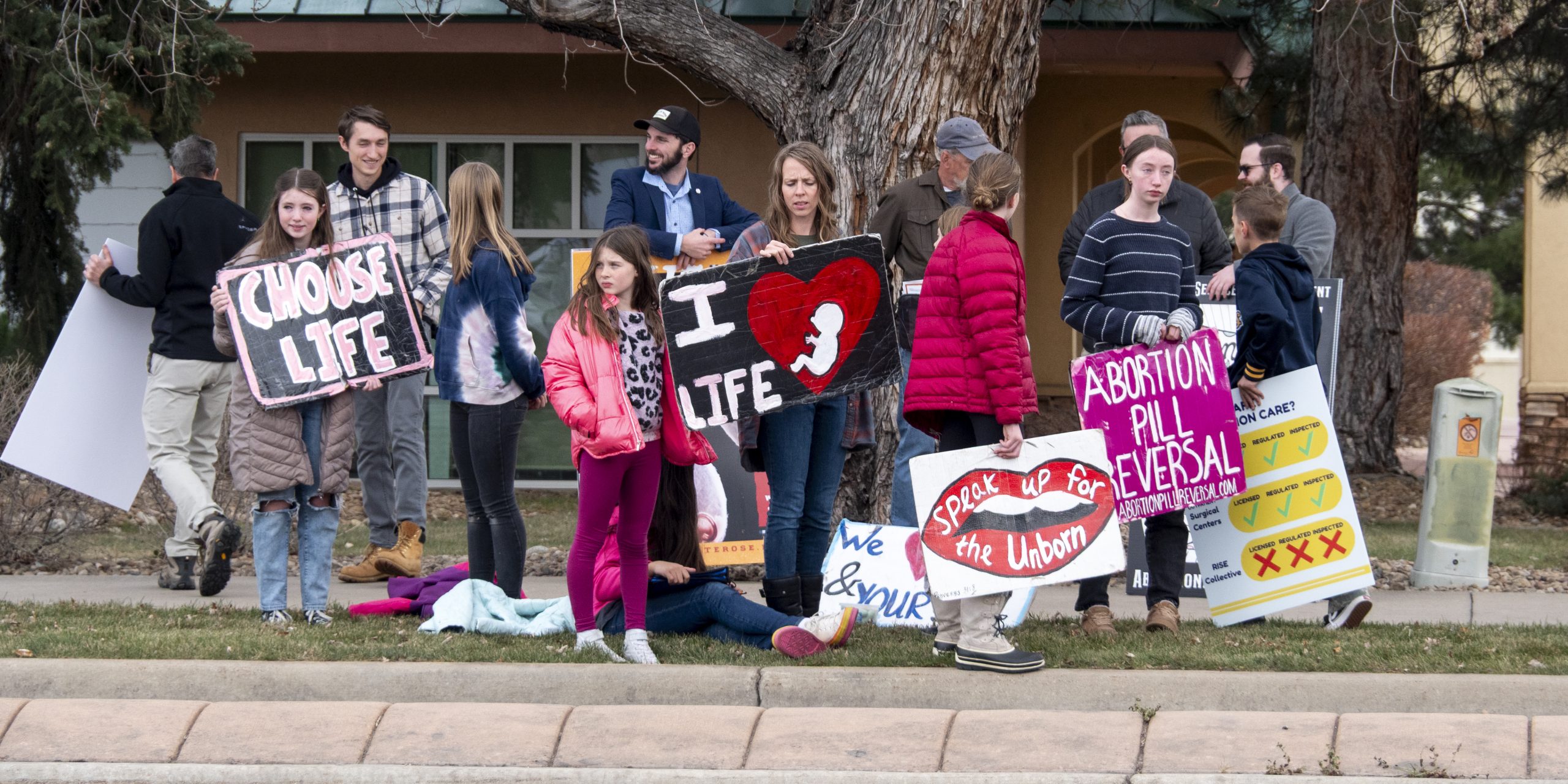 Anti-Abortion protestors rally in front of RISE Collective, Boulder