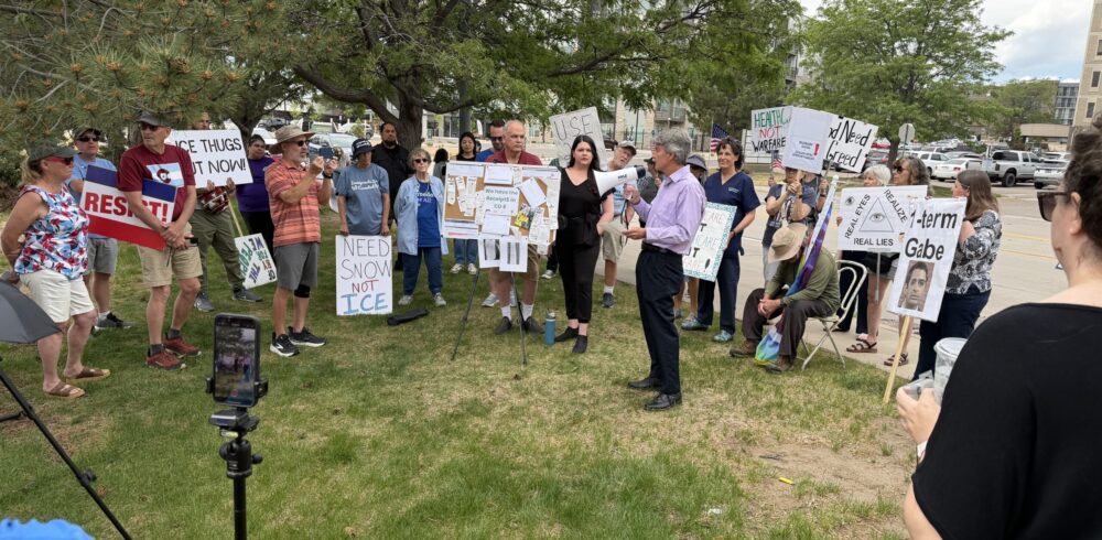 Displaying Receipts for Groceries & Gas, Protesters Blame GOP Congressman Gabe Evans for Busting Their Budgets