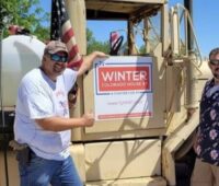 Gage Montoya and Ty Winter pose with Winter's statehouse campaign sign. Photo: Gage Montoya FB, July 21, 2022